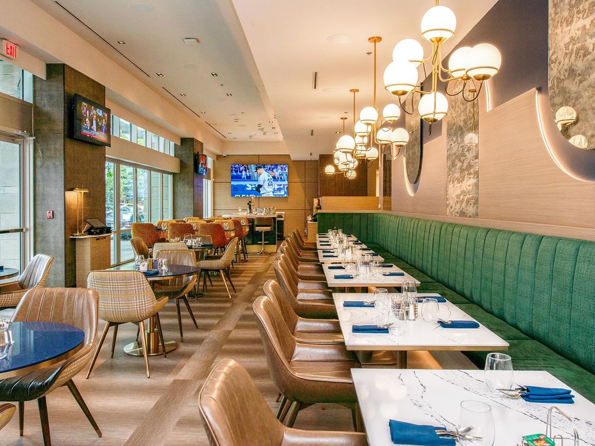 Dining space with tables and warm lighting.