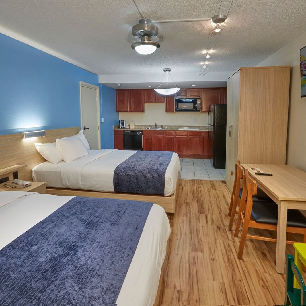 Room with two queen beds at Flamingo Waterpark Resort