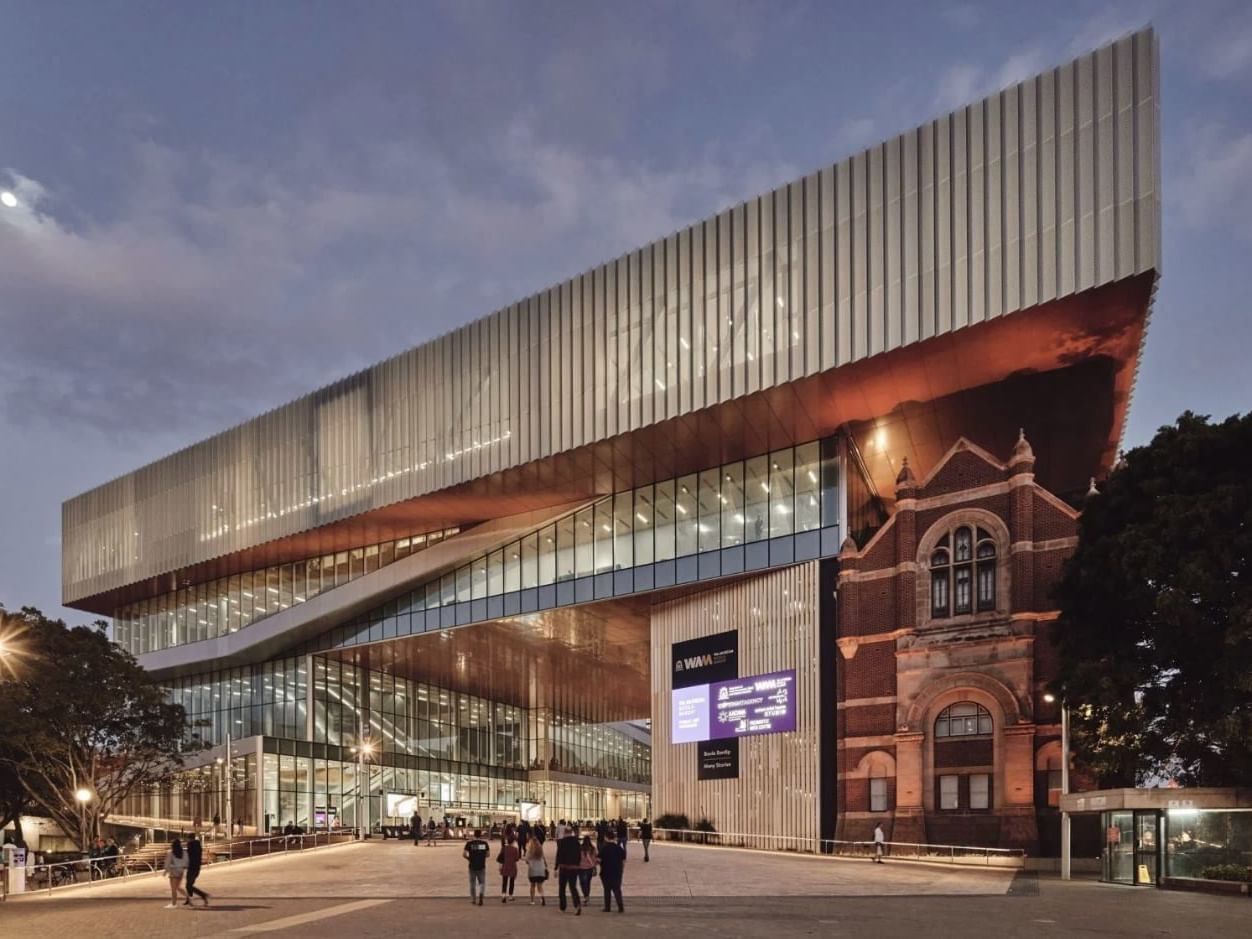 Illuminated exterior of WA Museum Boola Bardip near Melbourne Hotel Perth