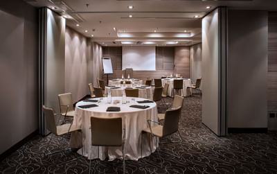 Banquet table setup in an event room at Uptown Palace Milan