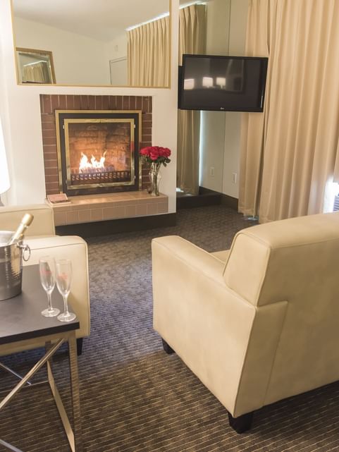 Lounge area with a fireplace in Cove Harbour at Cove Pocono Resorts