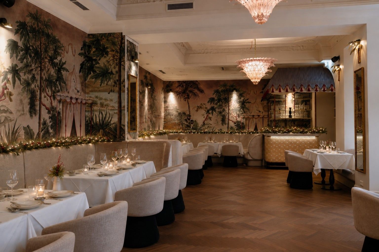 Salon Jungle at Hotel THE LEO GRAND with festive table settings, Christmas decoration, candlelight and tropical wall art