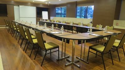 Safir meeting room with U-shaped table, and natural light from large windows at The Saujana Hotel Kuala Lumpur