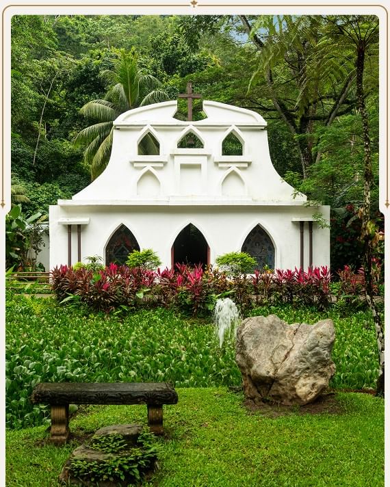 White garden structure surrounded by lush greenery at Santa Lucia Jungle Hacienda, Costa Rica rainforest resort