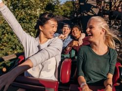 People on a rollercoaster at Magic Kingdom near Mystic Dunes Resort