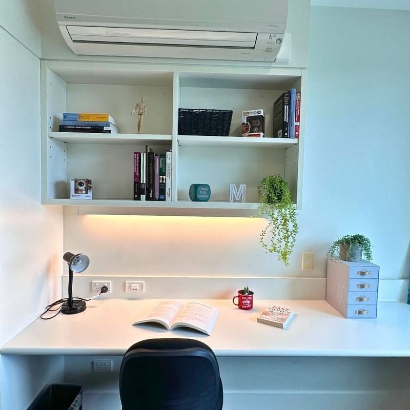 Modern student room with desk, chair, and built-in shelving at La Trobe University - McFarlane's Hill Residences.