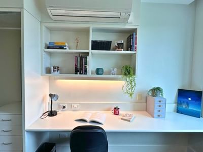Modern student room with desk, chair, and built-in shelving at La Trobe University - McFarlane's Hill Residences.