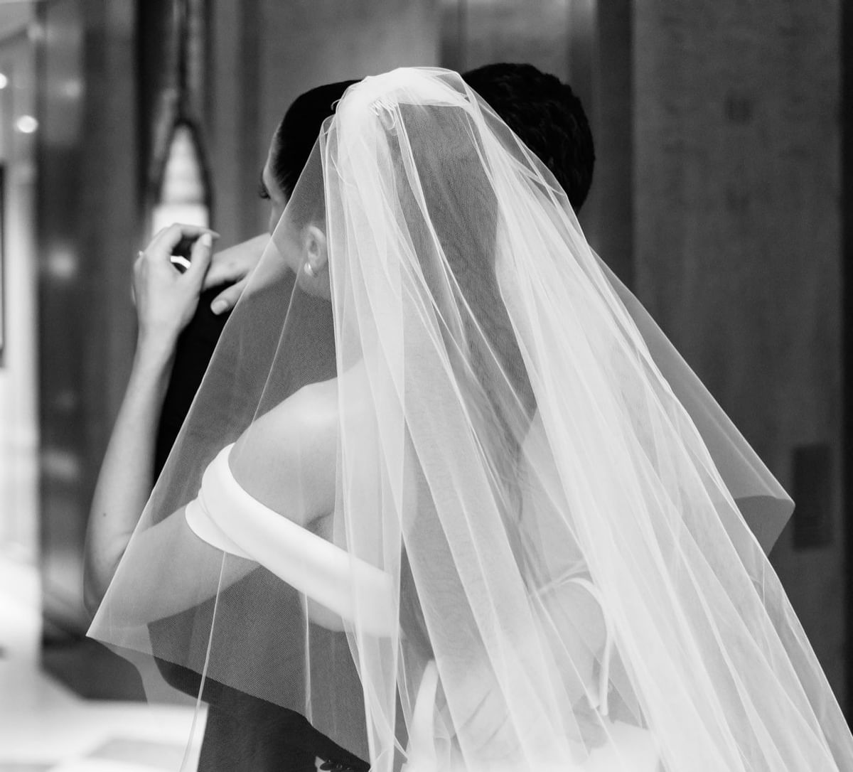 B & W portrait of a bride & groom embracing at Crown Towers