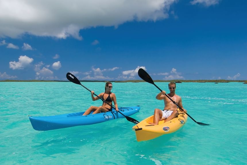 View of couple kayaking on the sea at Windsong Resort On The Reef
