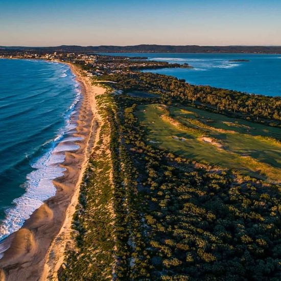 Scenic view of beach and golf course near Pullman Magenta Shores