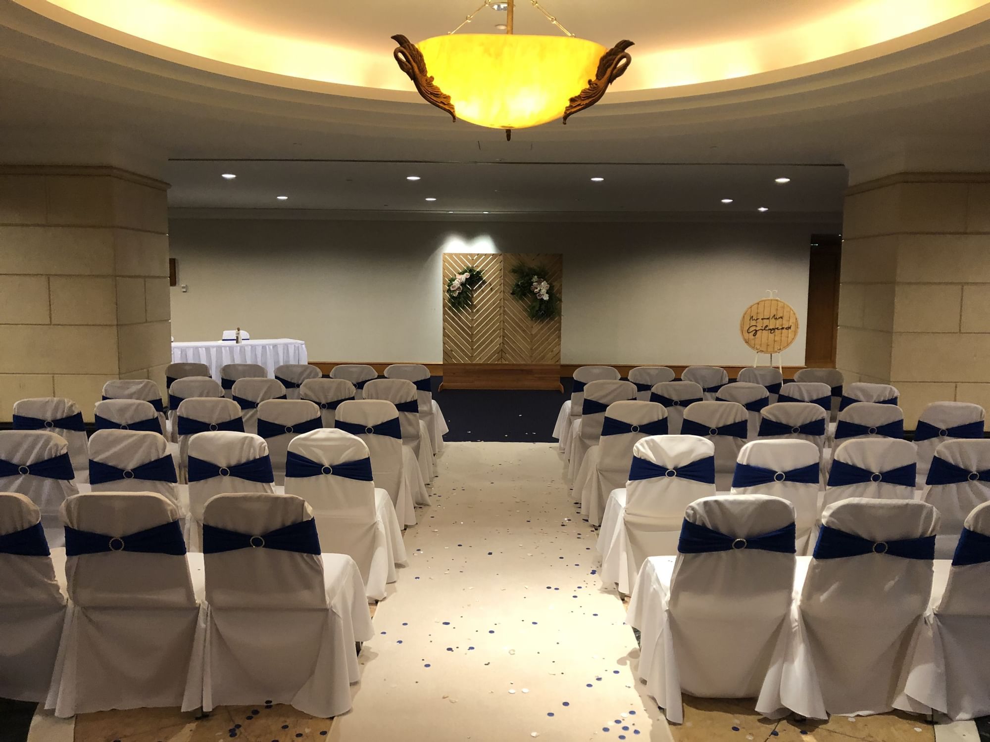 A wedding reception with white chairs at the Duxton Hotel Perth