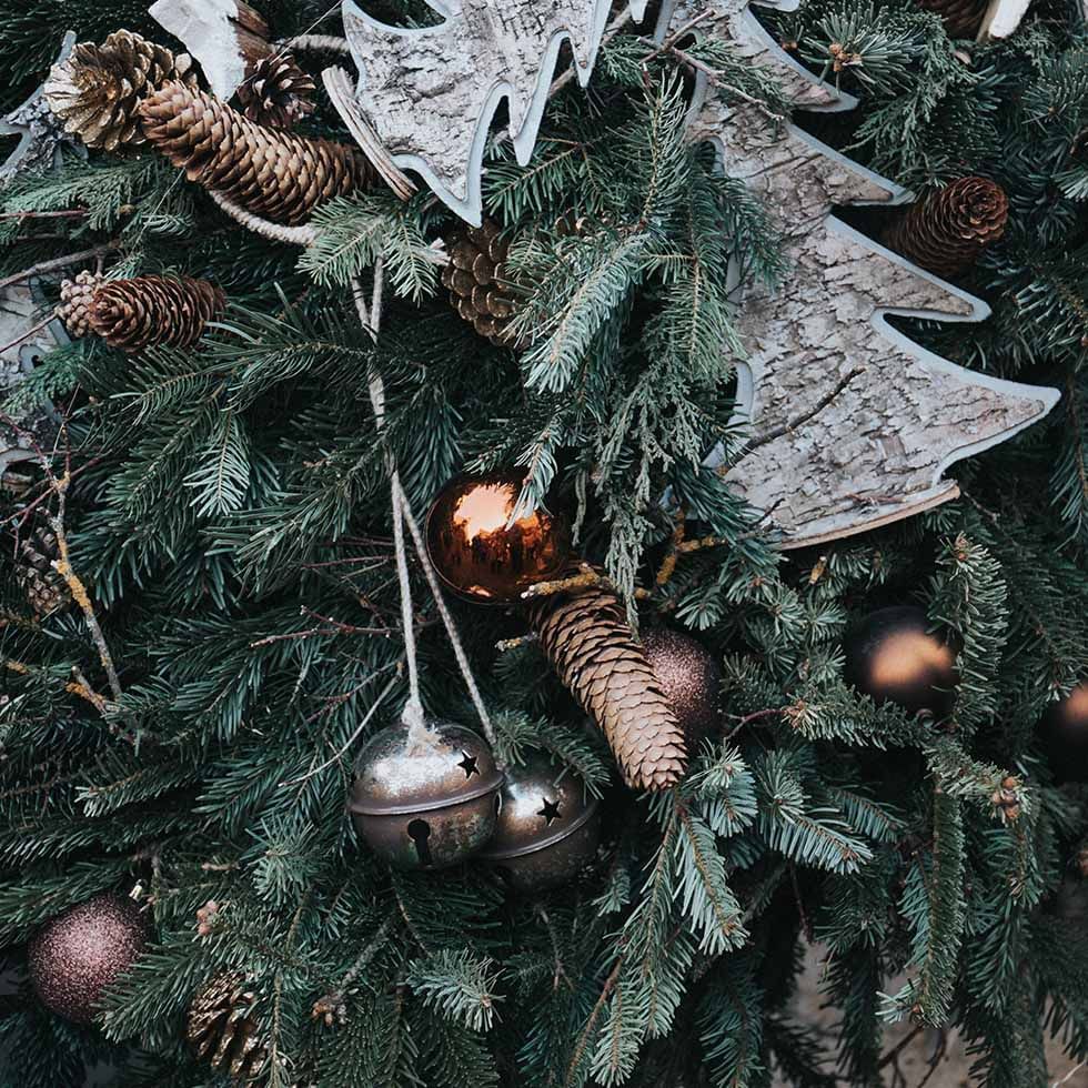 A Christmas tree with decorations at Falkensteiner Hotels