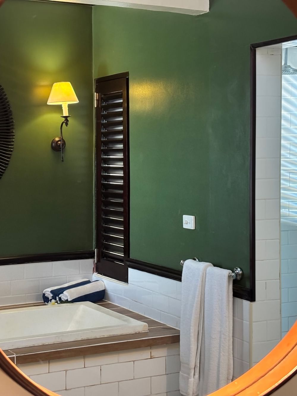 Bathroom with bathtub and white towel at Warwick Le Lagon - Vanuatu, Efate.