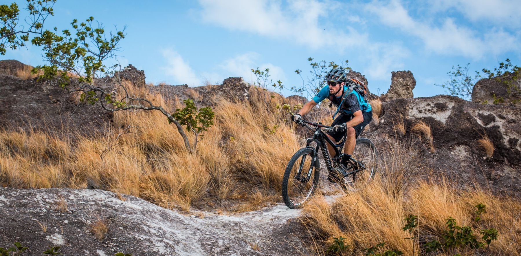 Man mountain biking on the trail near Hotel Rio Perdido