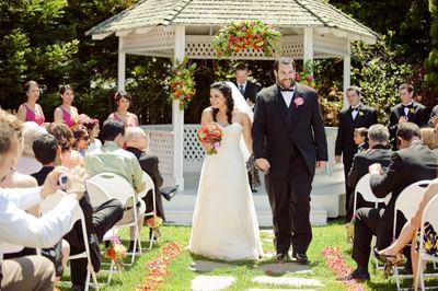 Bride and groom walking down aisle
