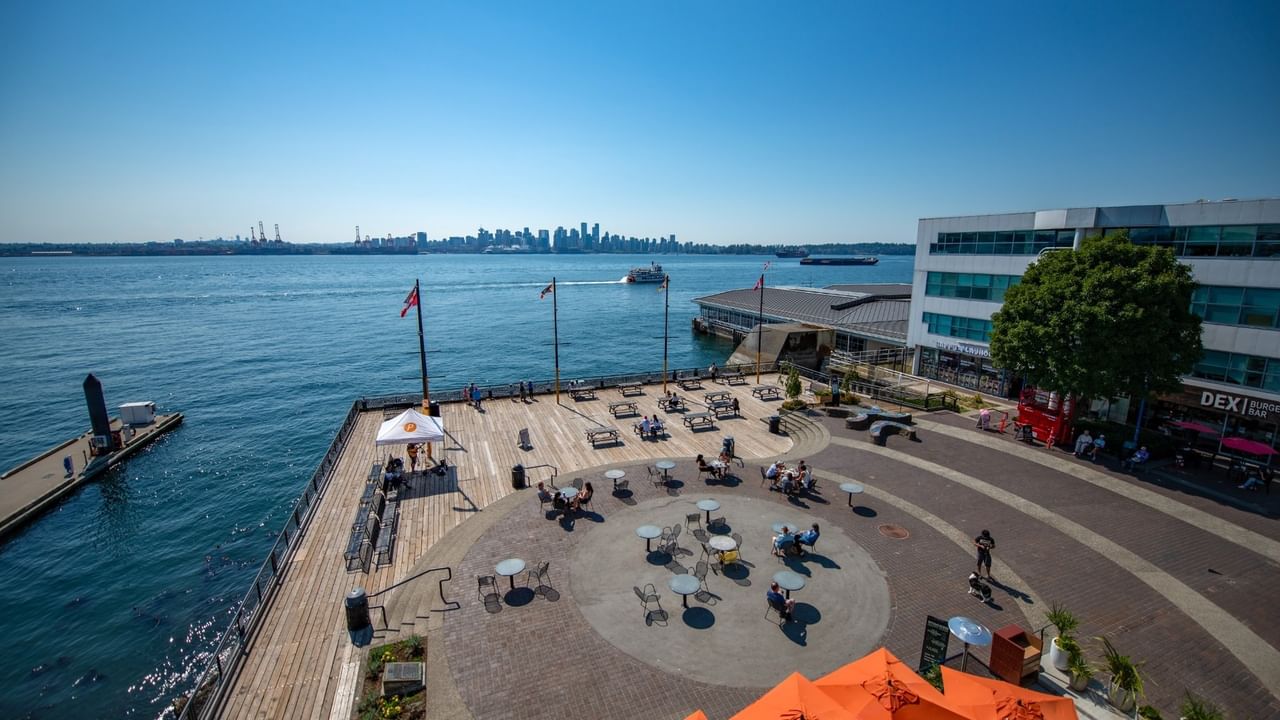 Waterfront area with a pier overlooking the city skyline of Vancouver at Coast Lonsdale Quay Hotel