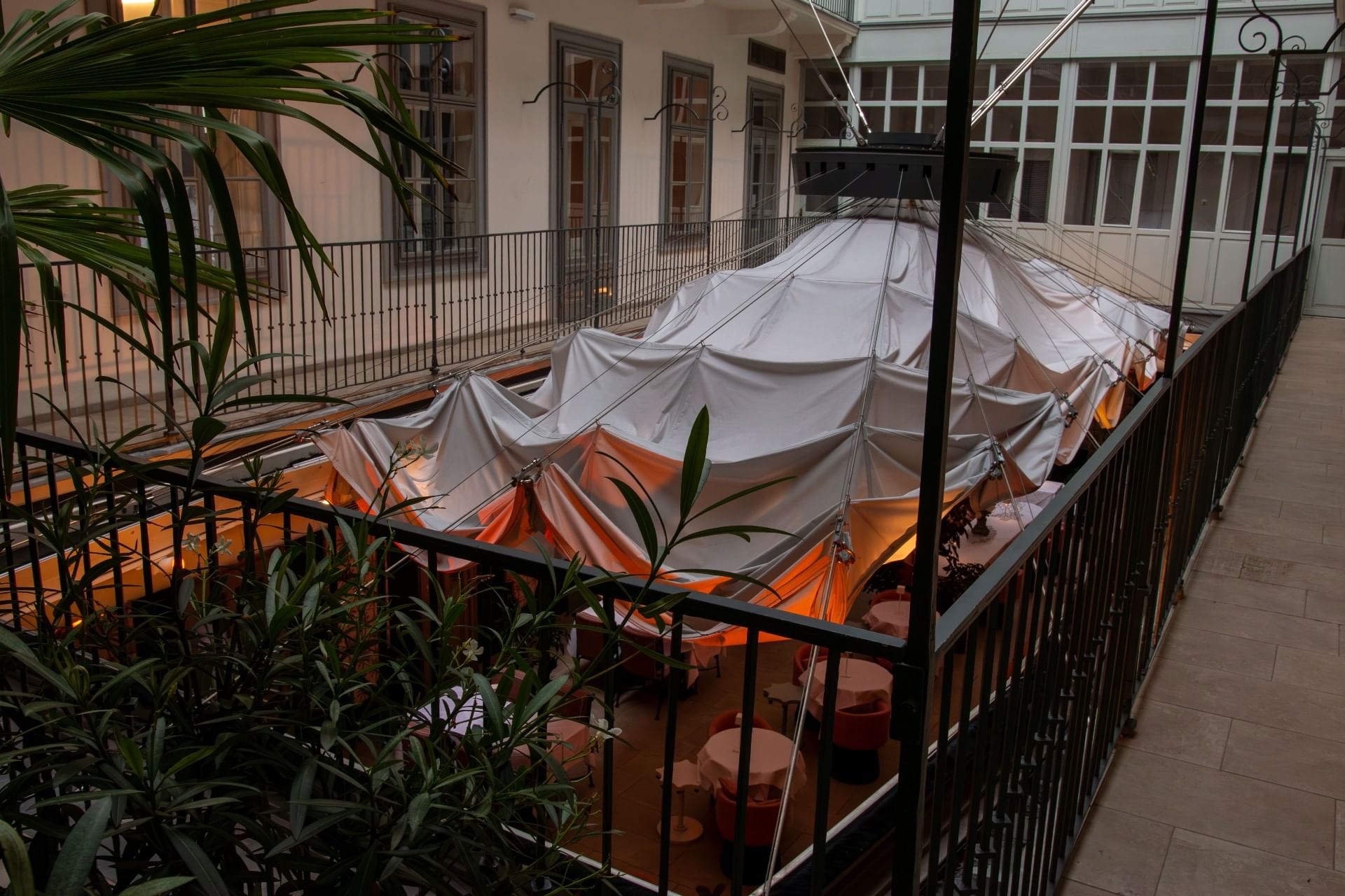 The Patio at Hotel THE LEO GRAND with covered courtyard, warm lighting and elegant atmosphere