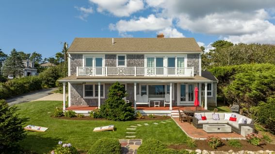 Front exterior view of Eventide 4 bedroom House with the front garden at Chatham Tides Resort