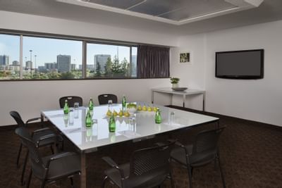 Meeting table with sparkling water and fruit