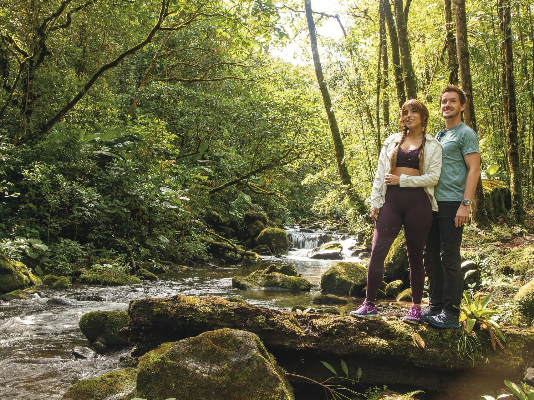 couple standing near river