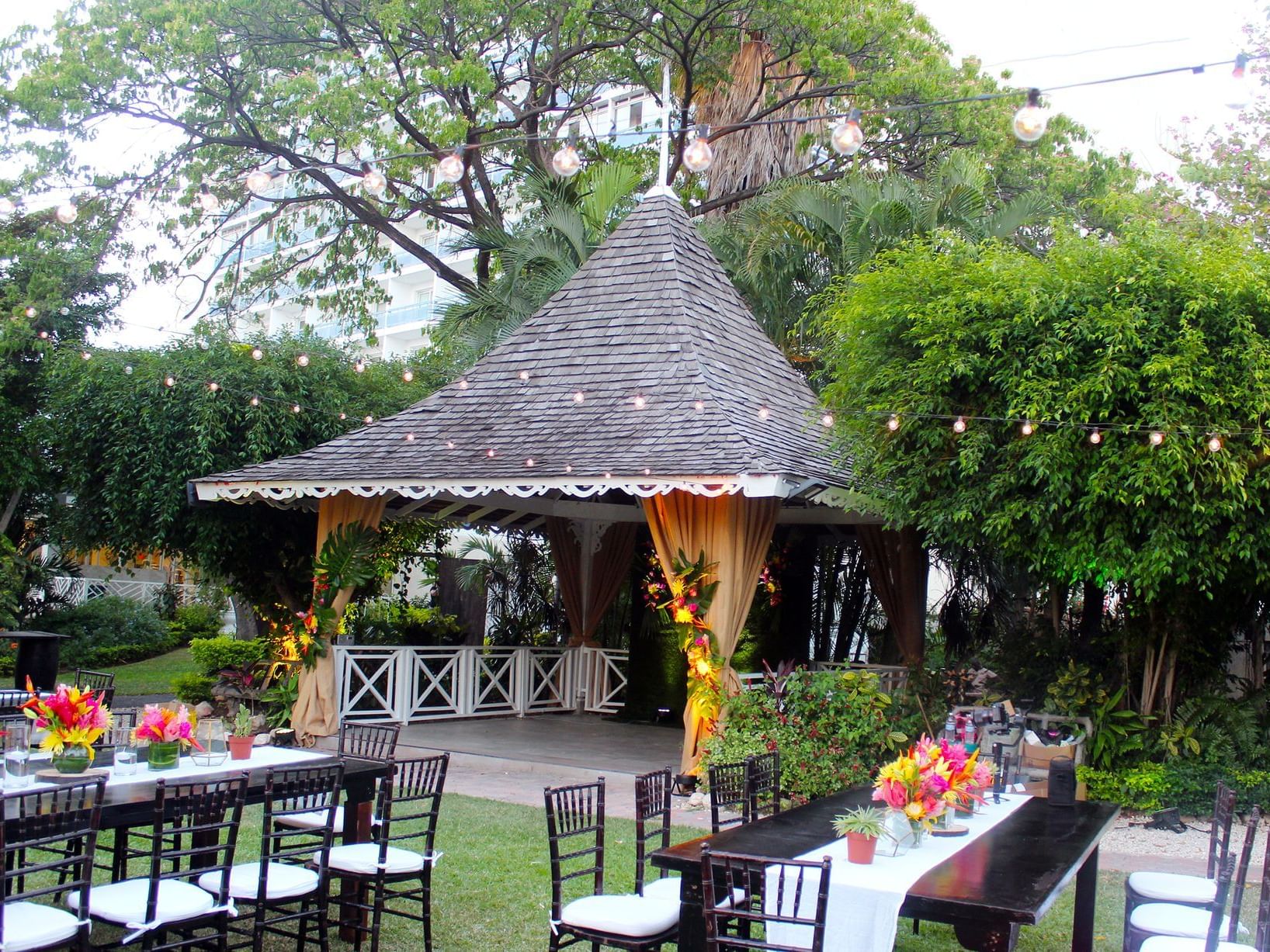 Garden wedding arrangement with tables at Jamaica Pegasus Hotel