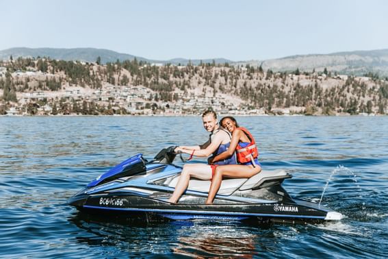 A couple on a jet ski near Manteo Resort Waterfront