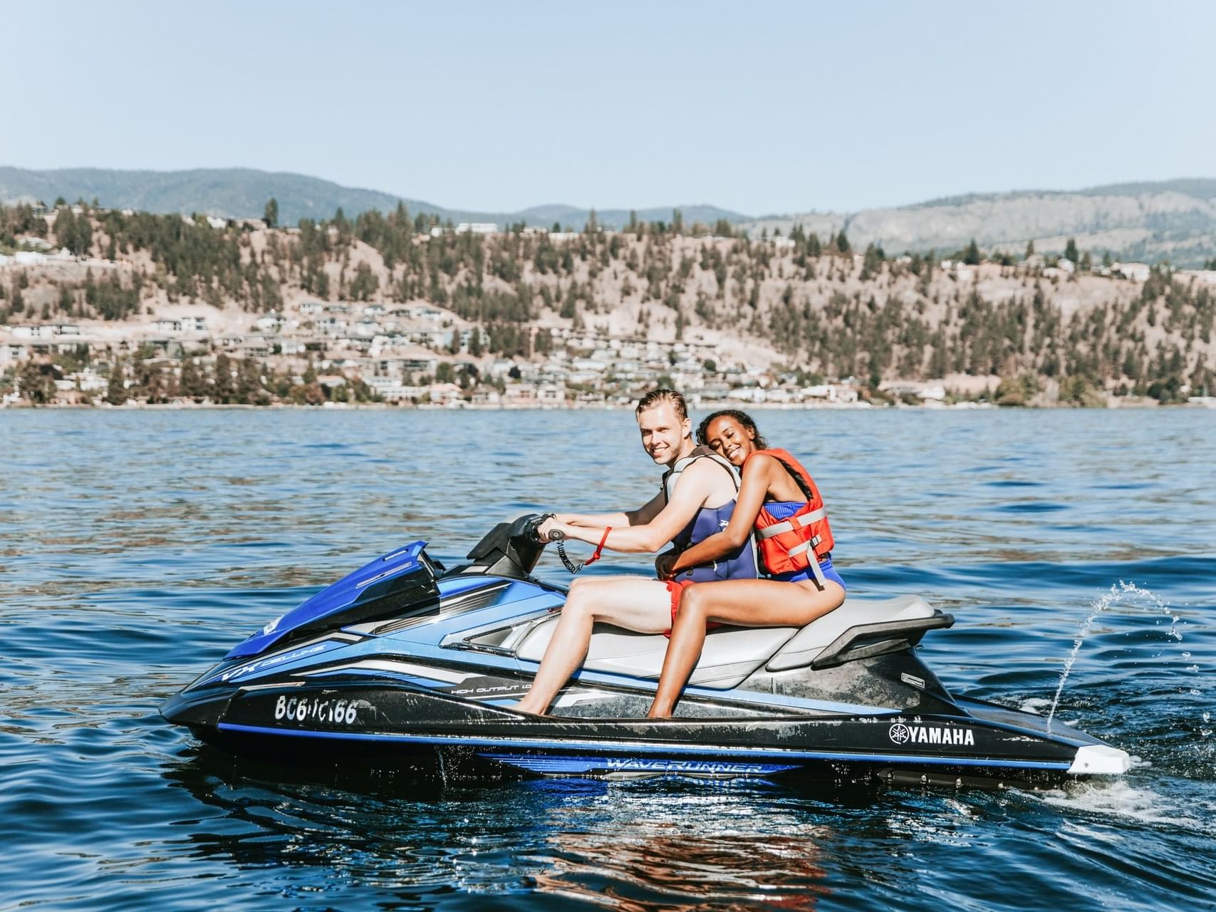 A couple on a jetski near Manteo Resort Waterfront
