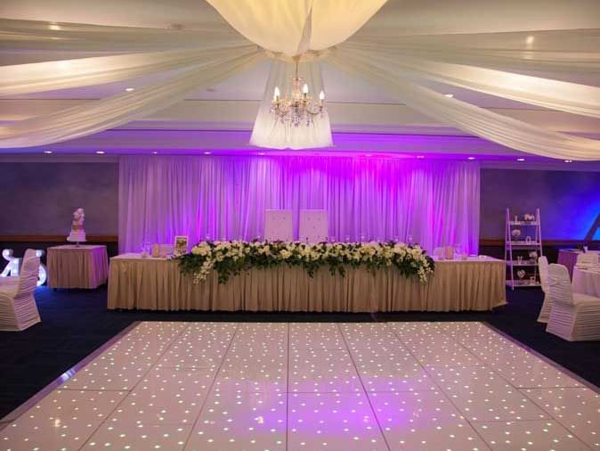 A wedding reception decorated with lights at Duxton Hotel Perth