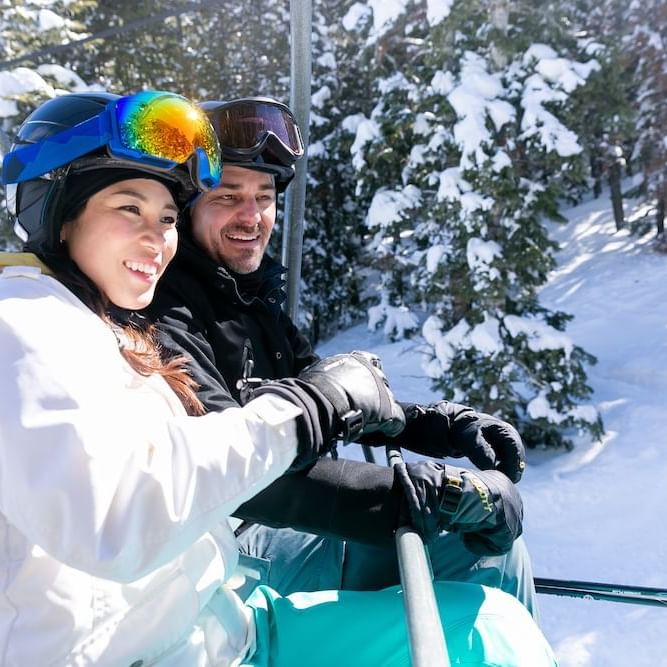 Couple talking on chairlift