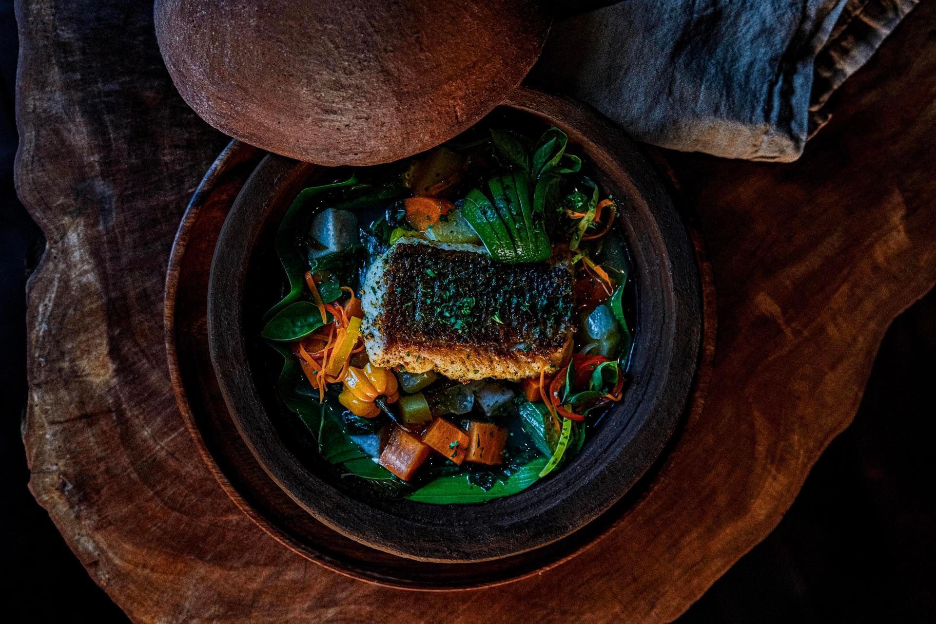 Grilled fish served on a Pepper pot in Dasheene Restaurant at Ladera Resort