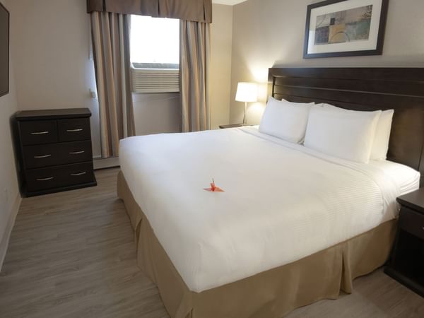 Hotel suite with bed and TV
