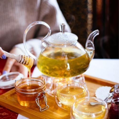 Families drinking tea together, part of the Tolbe Arab wedding tradition