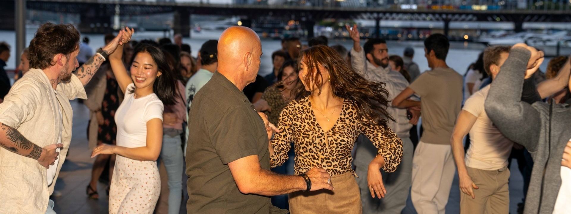 People enjoying Latin Nights by the Bay at Novotel Sydney on Darling Harbour