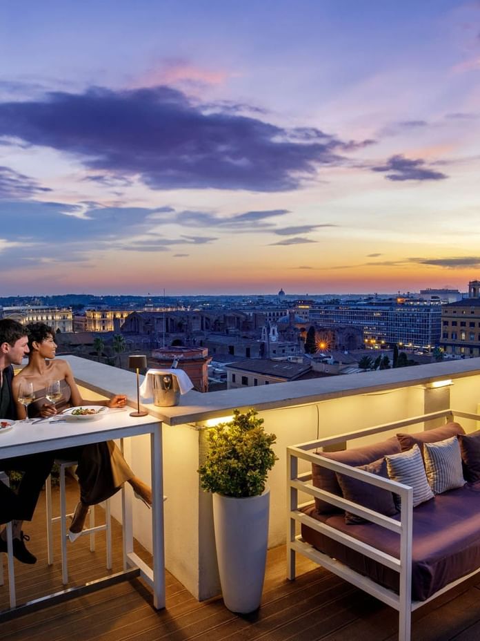 Stay & Dine Package offer featuring a couple enjoying a romantic dinner on Terrazza Cielo rooftop at The Independent