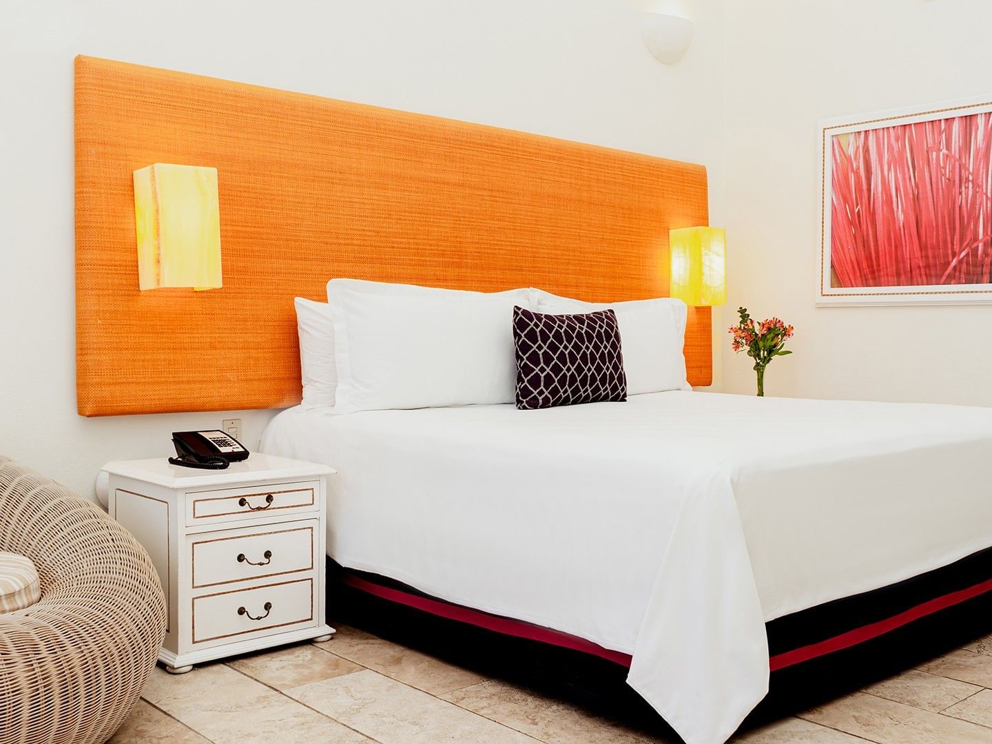 Nightstand & cozy chair by the bed with cushioned headboard in King Deluxe Private Pool at Camino Real Zaashila Huatulco