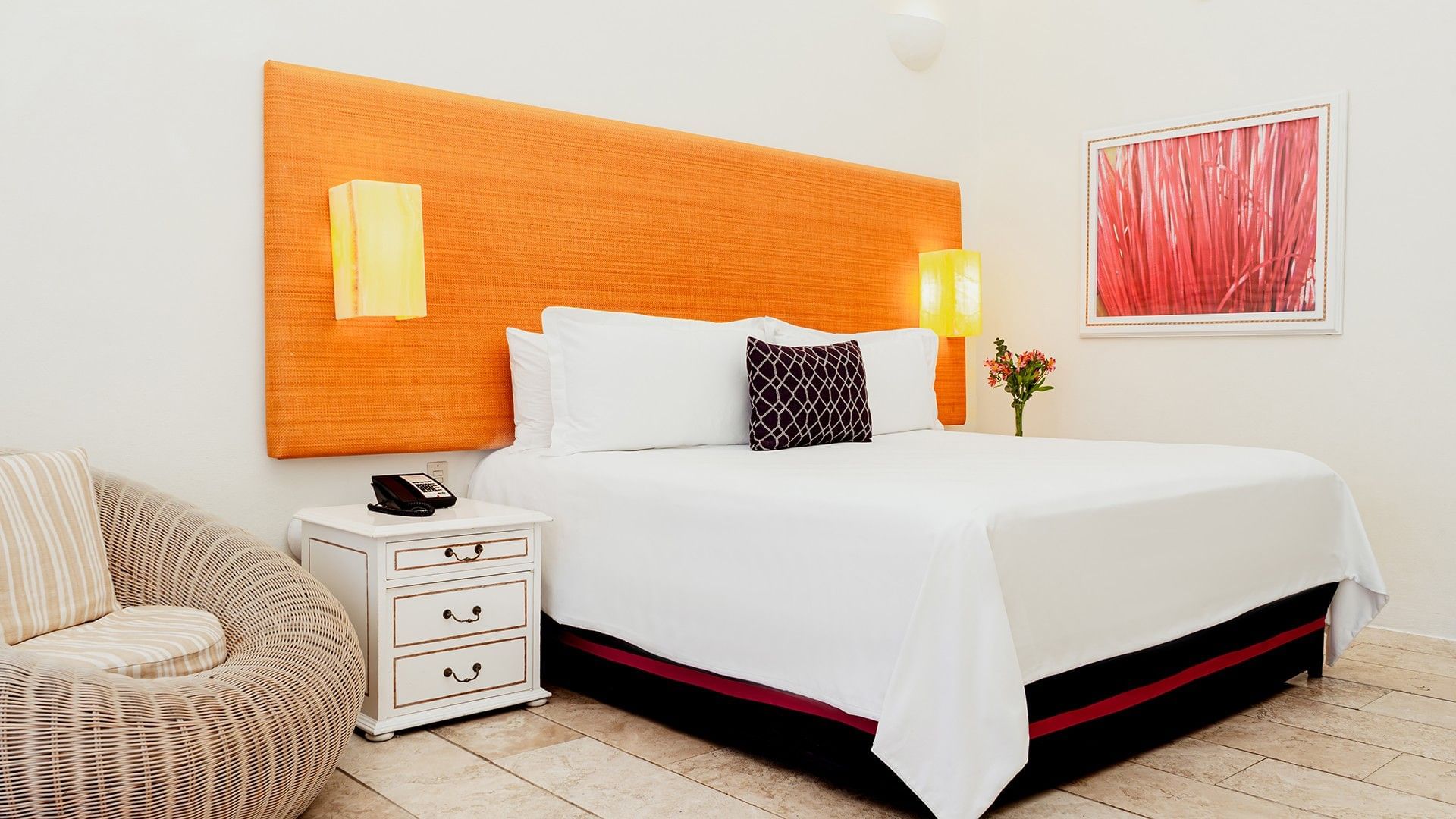 Nightstand & cozy chair by the bed with cushioned headboard in King Deluxe Private Pool at Camino Real Zaashila Huatulco