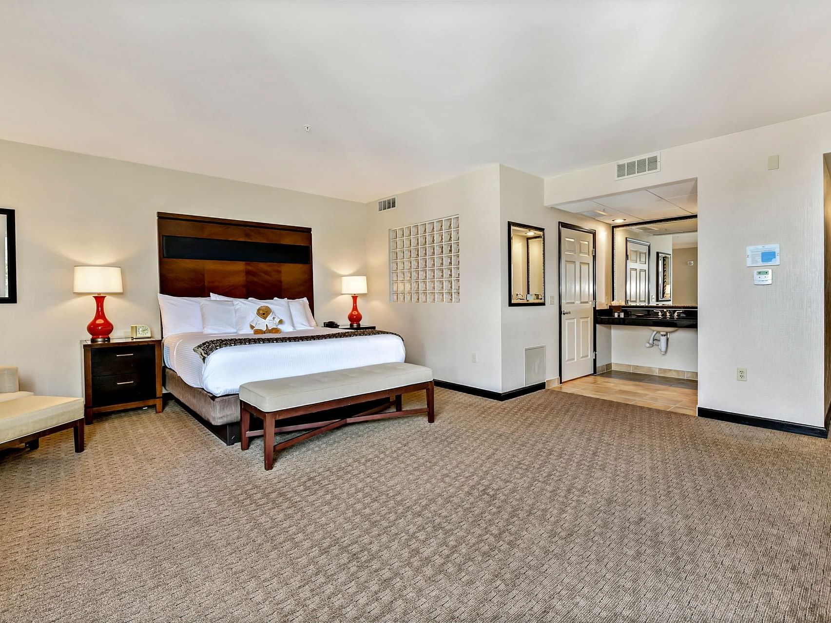 King bed & furniture in a room at Hotel 43