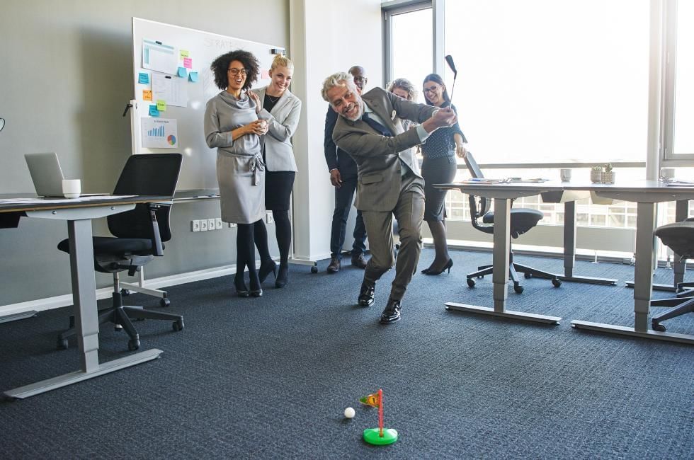 Awesome wellbeing activities for team meetings featuring min-golf