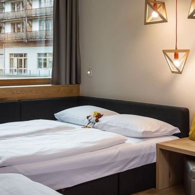 Double bed in Deluxe Room at Falkensteiner Hotel Cristallo