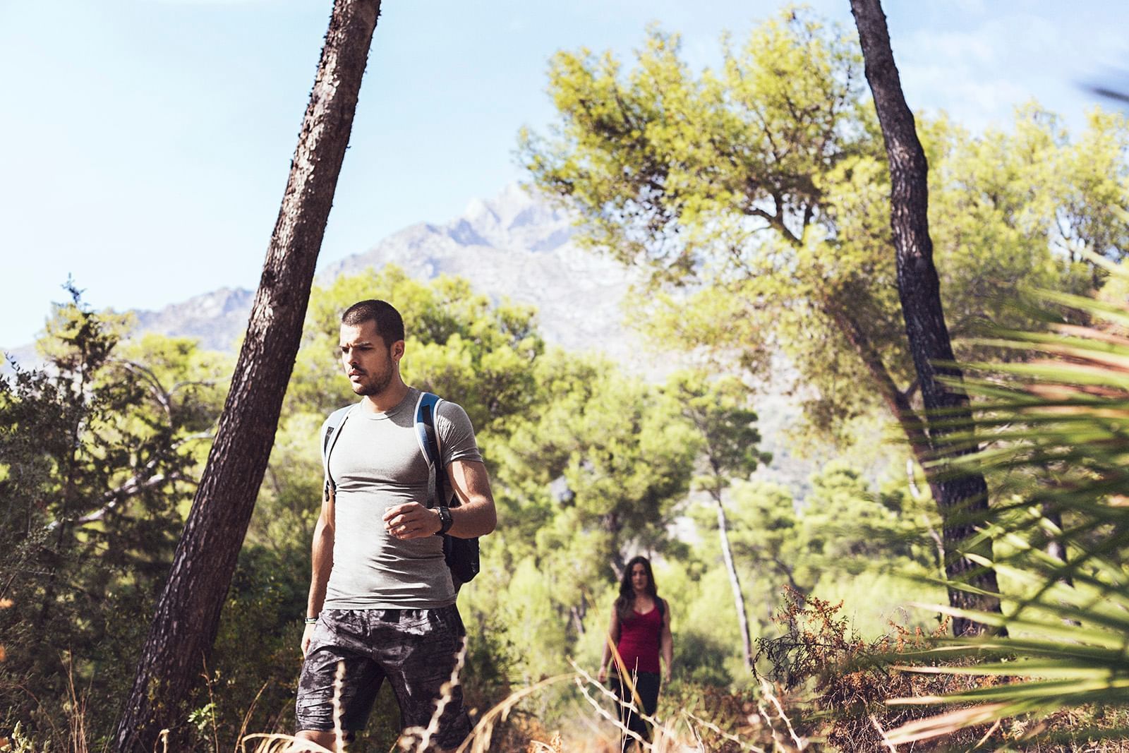 A couple on their way to hiking near Marbella Club Hotel