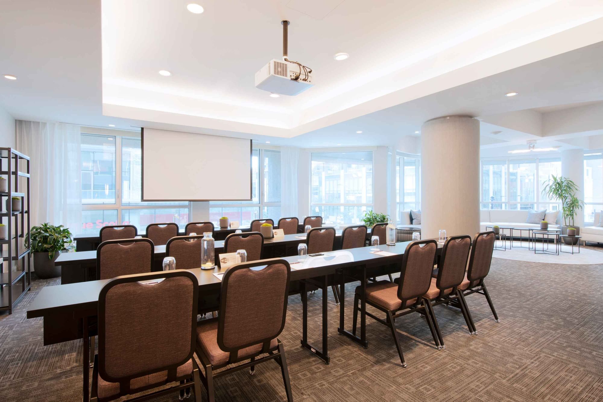 Classroom set-up with a projector screen in Salon De La Montagne at Warwick Hotels and Resorts