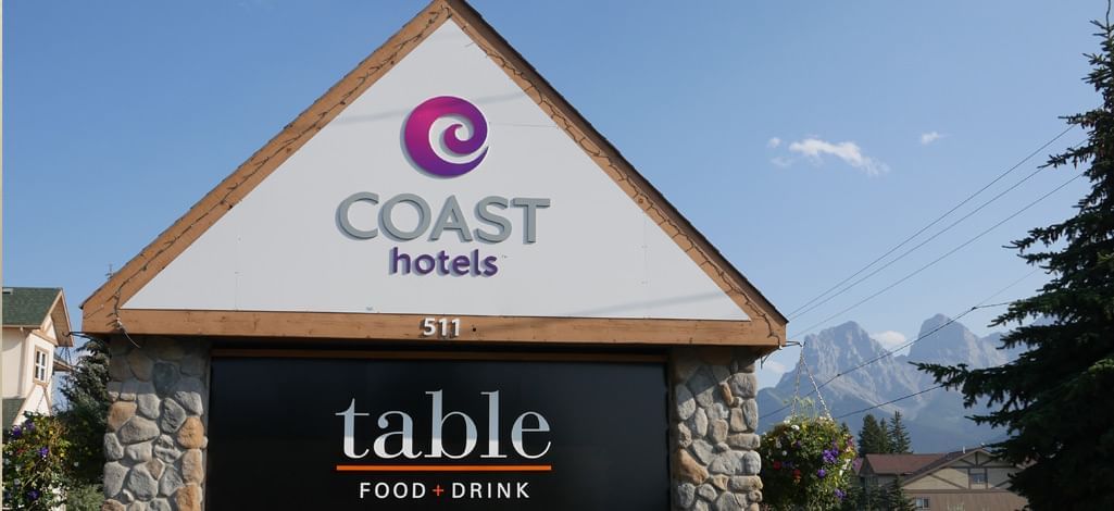 Discover Table Food + Drink, nestled against the scenic Canmore mountain backdrop.