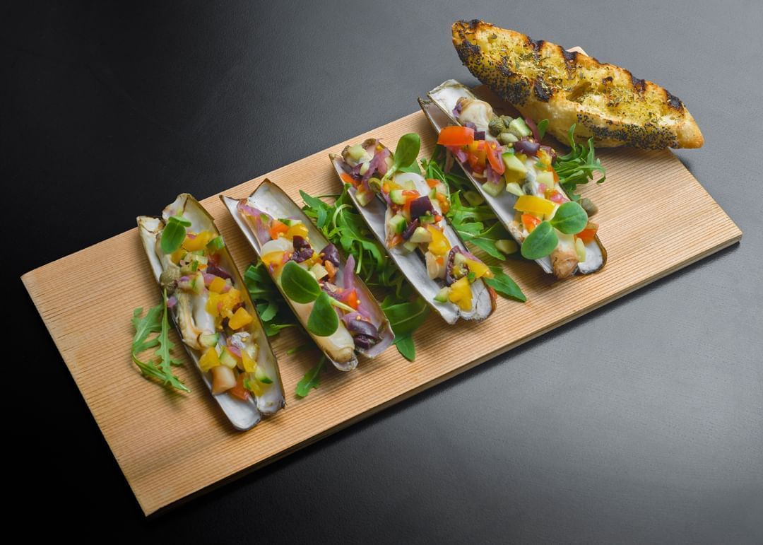 Close-up of Grilled razor clams with caponata served in The Avenue at Hotel Barsey by Warwick - Brussels