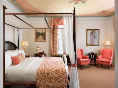 King bed with loungers in Belleville Room at Pendray Inn & Tea House