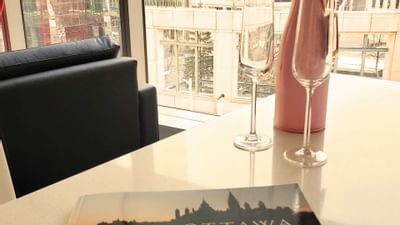 A magazine by a bottle & glasses at ReStays Ottawa