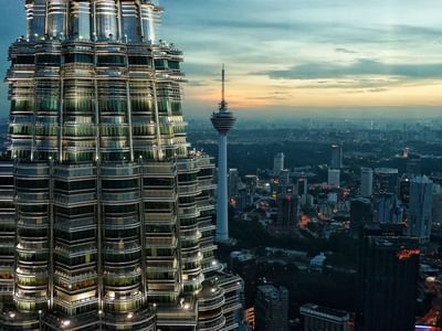 Close-up of a Petronas Twin Towers with a cityscape view near Sunway Velocity Hotel