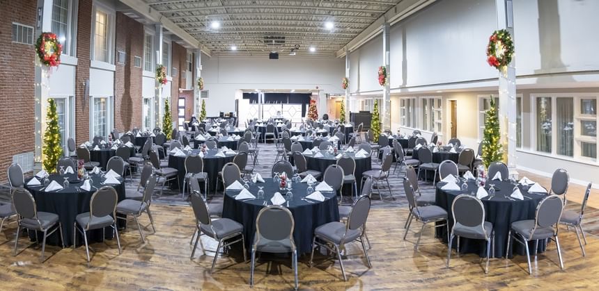 Large event space set with round tables and chairs, ready for Charlottetown, PEI events at Rodd Royalty