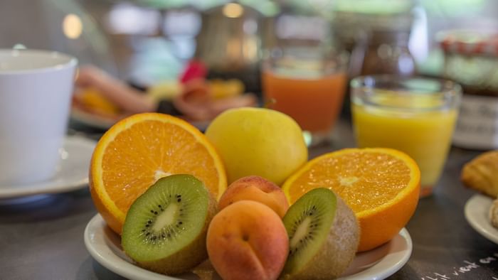 Closeup of oranges, kiwi, peach plate at Hotel Solana