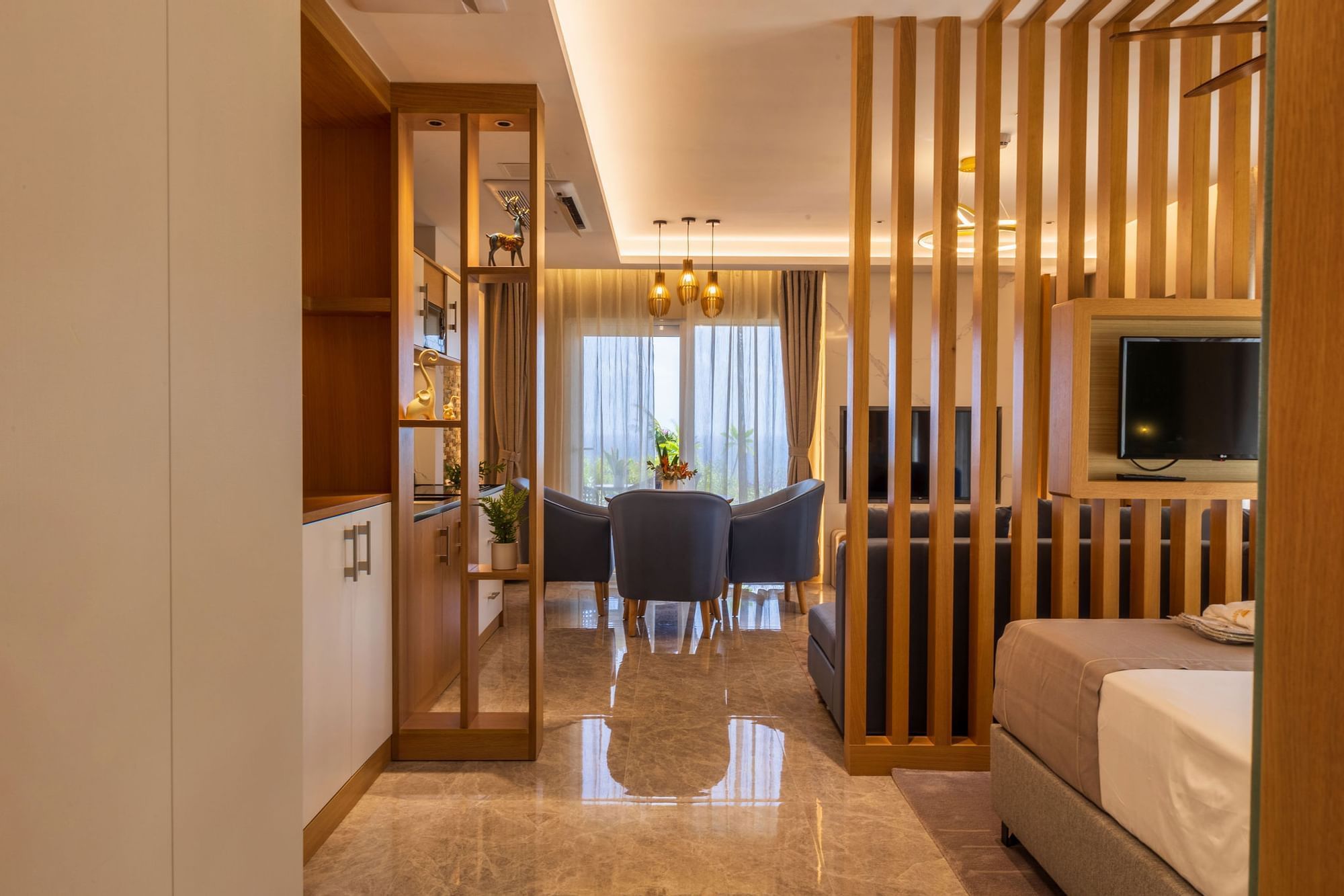 Bed & living area in Villa Suite at Golden Rock Resort