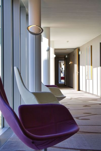 Hotel lounge area in a hallway at Starling Hotel Lausanne near Saint Sulpice Hotel